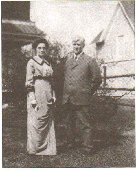 Elmer and Mary Woodward outside their home at 817 Haskell Ave_ Rockford_Ill_.jpg
